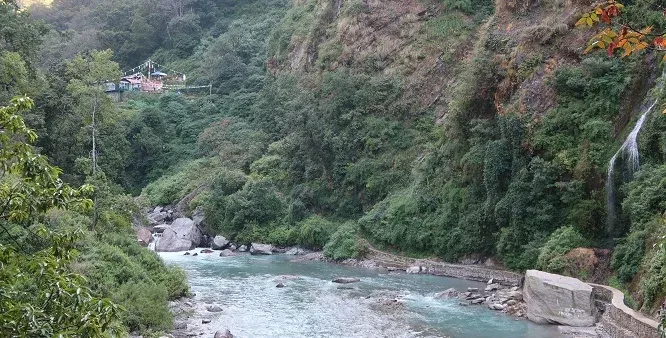 Scenic Langtang Valley trekking route through alpine landscapes with snow-capped Himalayan mountains in Langtang National Park, Nepal.