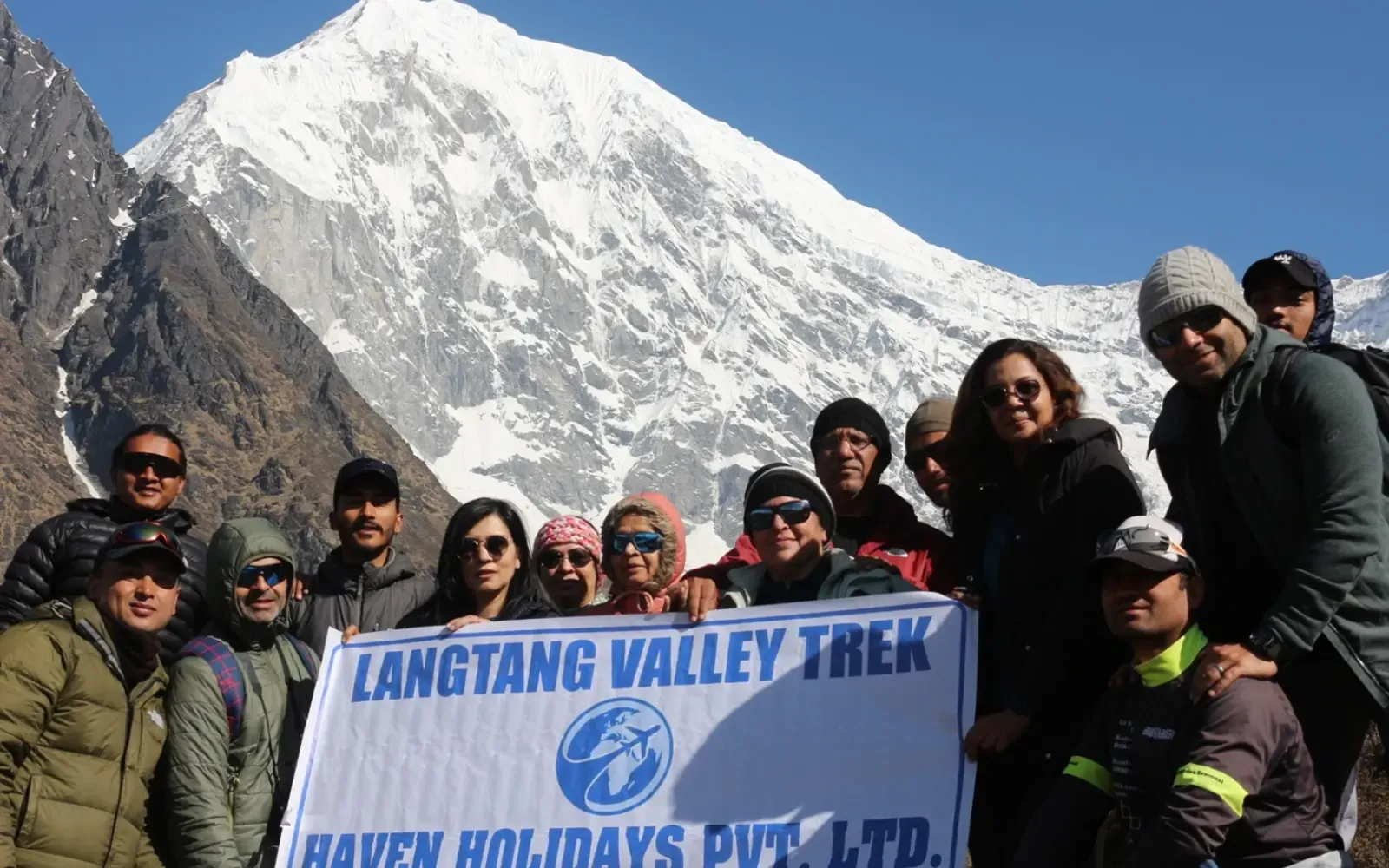 Trekkers enjoying the Langtang Valley Trek with Haven Holidays Nepal, exploring scenic Himalayan trails surrounded by snow-capped mountains.