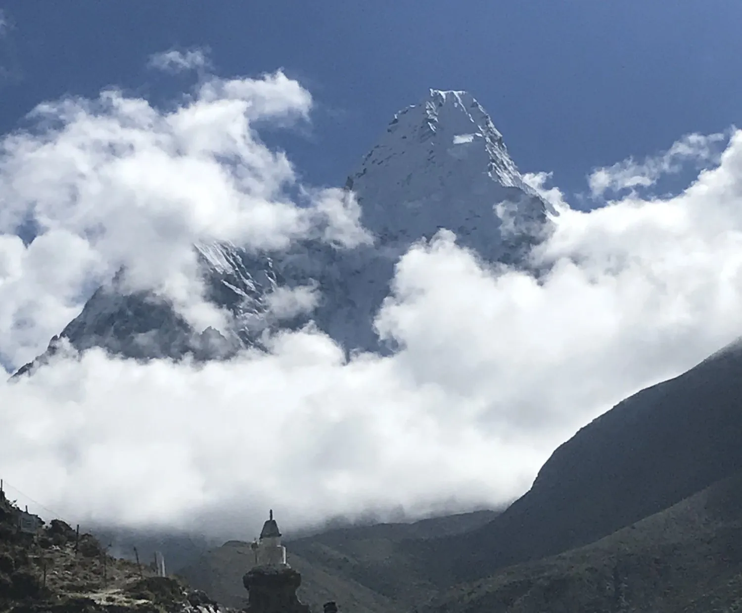 Monsoon trekking in Nepal through lush green Himalayan landscapes, dramatic clouds, and peaceful mountain trails.