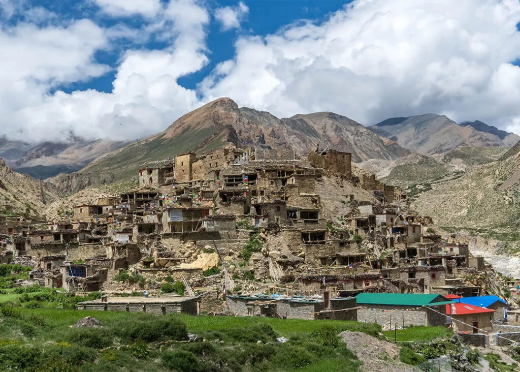 Nar Village surrounded by high Himalayan mountains in Nar Phu Valley.
