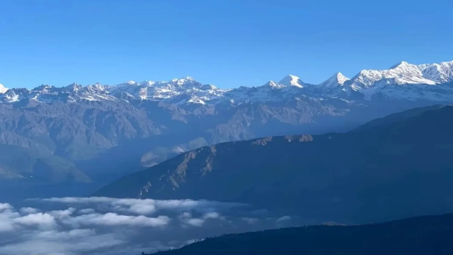 Golden sunrise over Mount Everest and the Himalayan mountain range from Pikey Peak in Nepal, with peaceful trekking trails and traditional Sherpa villages.
