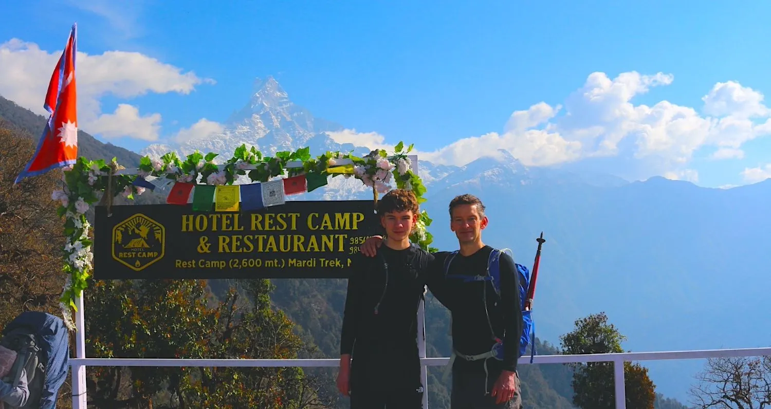 Trekkers descending the ridge from Mardi Himal Base Camp to Low Camp through alpine landscapes in Nepal.