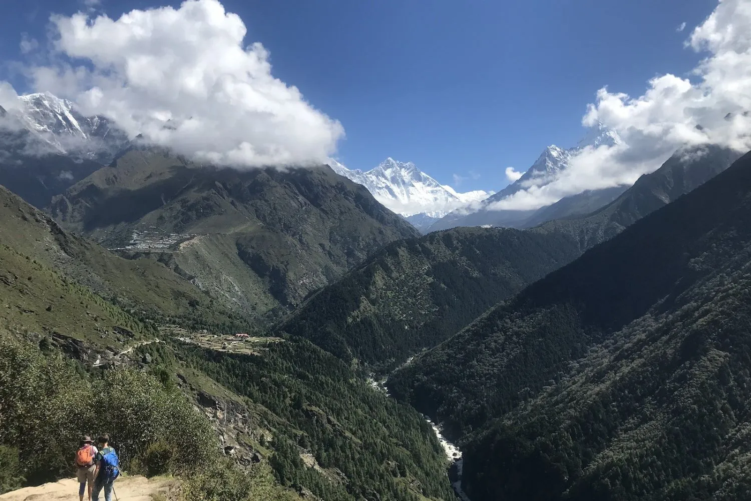 Safe monsoon trekking in Nepal with lush green forests, rainy mountain trails, and proper trekking gear.