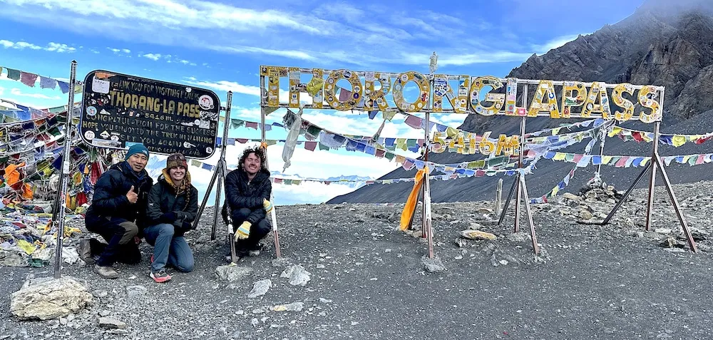 Thorong La Pass on the Annapurna Circuit Trek surrounded by high Himalayan mountains in Nepal.