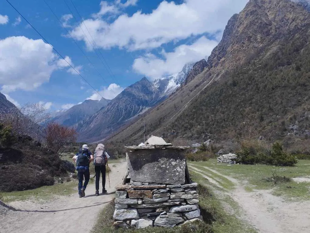Trekkers hiking along the Manaslu Circuit trail in Nepal.