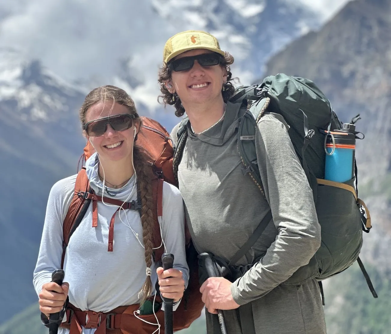 Trekker wearing lightweight hiking clothes while walking the Mardi Himal ridge with Himalayan mountain views in Nepal.
